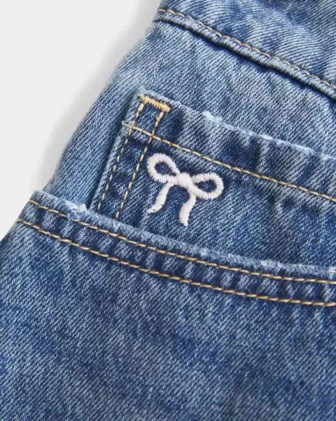 Curvy Low-Rise Embroidered Bow Denim Mini Skort