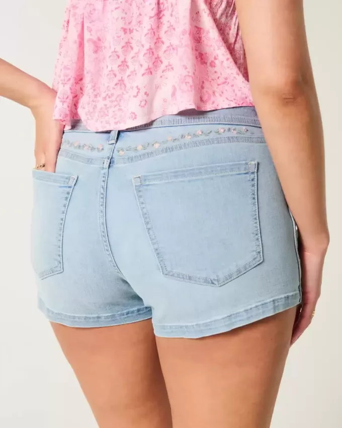 Curvy Low-Rise Light Wash Floral Embroidered Denim Shortie Shorts Curvy Low-Rise Light Wash Floral Embroidered Denim Shortie Shorts