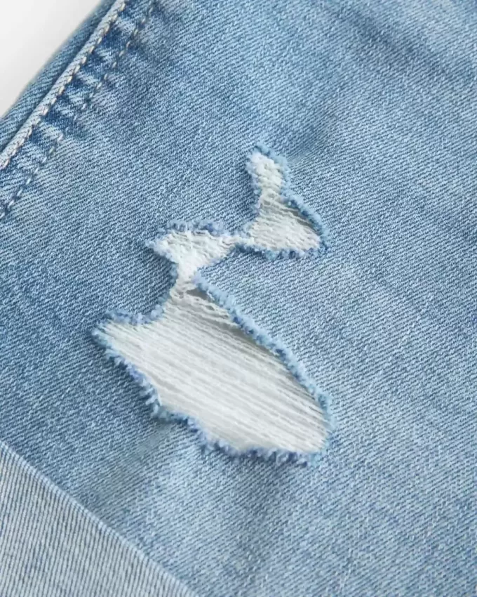 High-Rise Ripped Medium Light Wash Denim Shortie Shorts High-Rise Ripped Medium Light Wash Denim Shortie Shorts