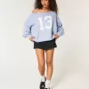 Hollister Comfy Cloud Easy Off-the-Shoulder Number Graphic Sweater Hollister Comfy Cloud Easy Off-the-Shoulder Number Graphic Sweater