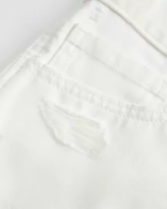 Low-Rise Distressed White Denim Mini Shorts