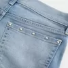 Low-Rise Medium Wash Studded Denim Shortie Shorts Low-Rise Medium Wash Studded Denim Shortie Shorts