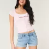 Low-Rise Ripped Light Wash Denim Shortie Shorts Low-Rise Ripped Light Wash Denim Shortie Shorts