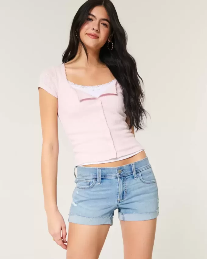 Low-Rise Ripped Light Wash Denim Shortie Shorts Low-Rise Ripped Light Wash Denim Shortie Shorts