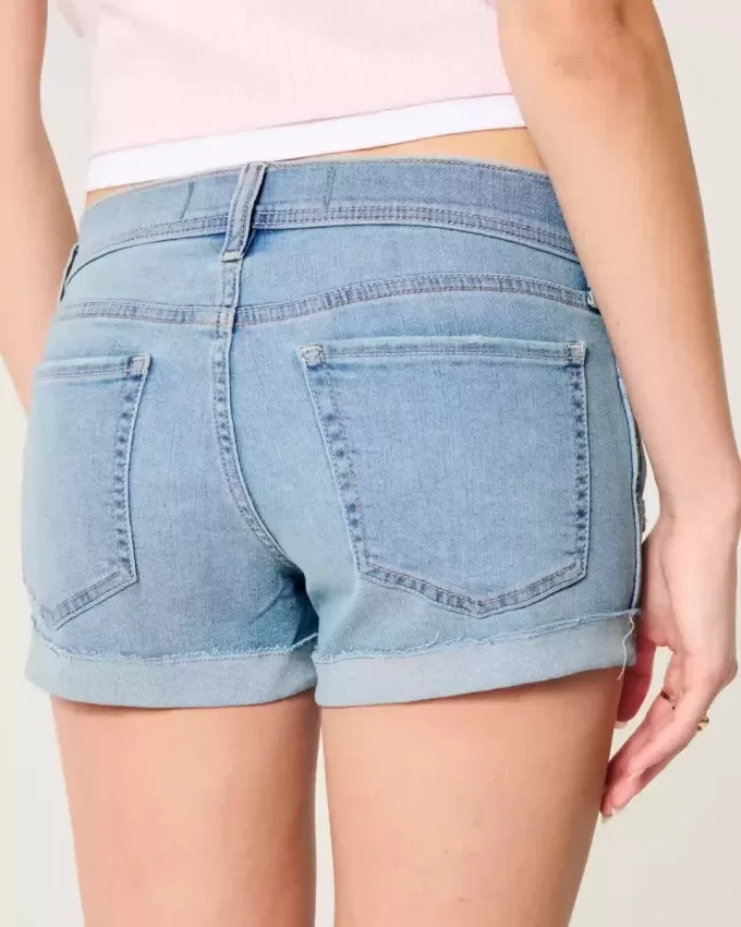 Low-Rise Ripped Light Wash Denim Shortie Shorts Low-Rise Ripped Light Wash Denim Shortie Shorts
