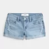 Low-Rise Ripped Light Wash Denim Shortie Shorts Low-Rise Ripped Light Wash Denim Shortie Shorts