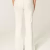 Ultra Low-Rise White Embroidered Pocket Flare Jeans